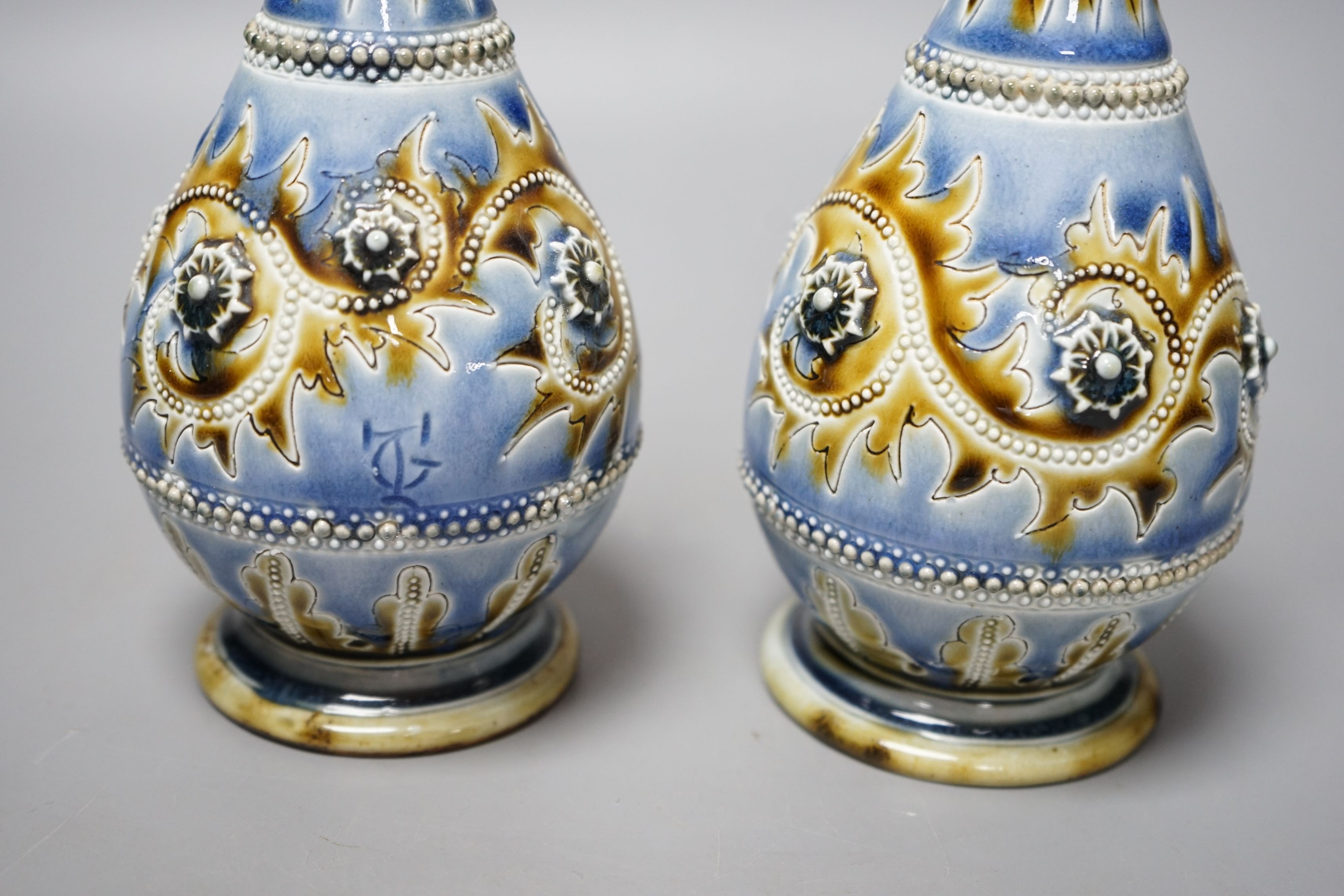 George Tinworth, a pair of Doulton Lambeth vases, stamped 1876, 20cm high